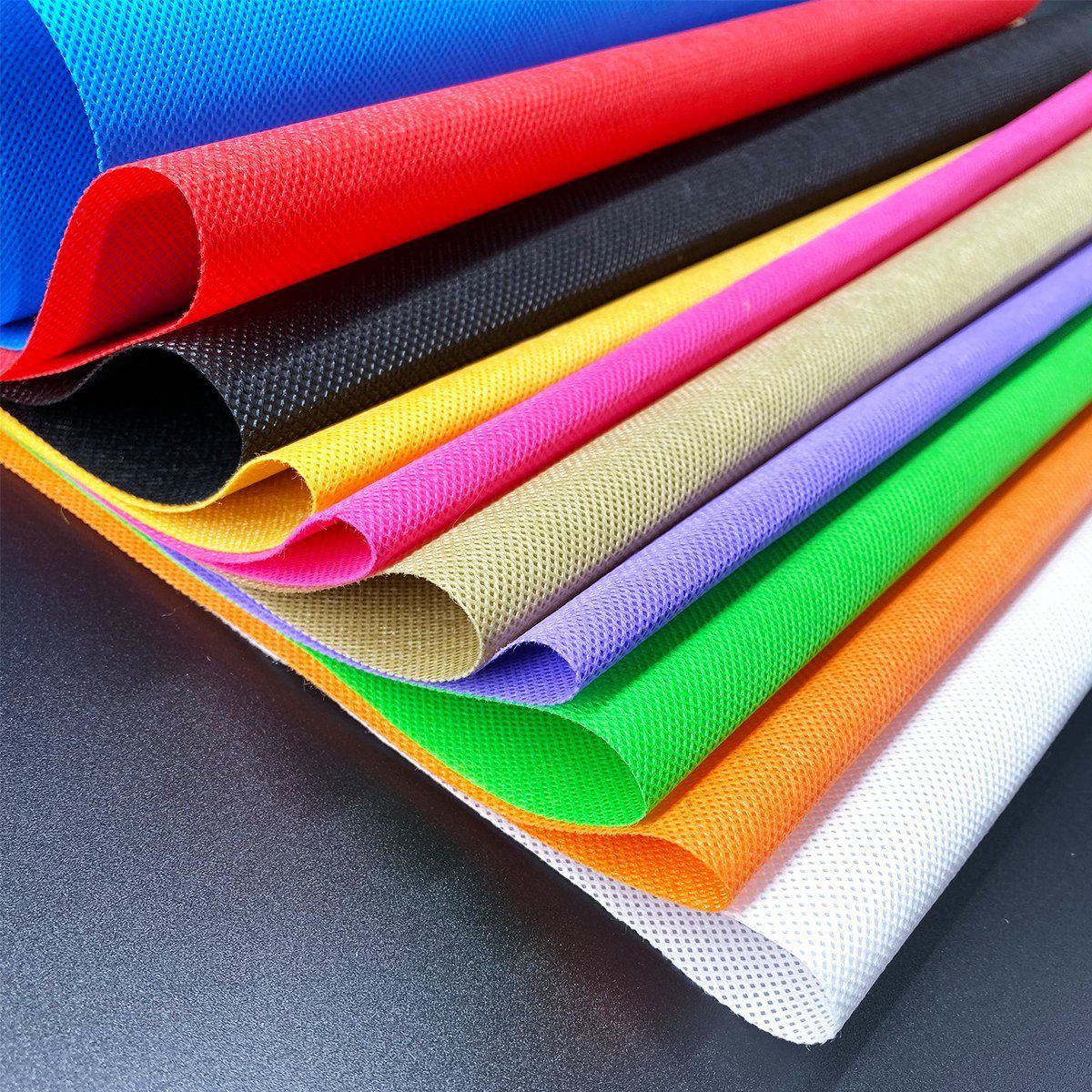 Spunbond nonwoven fabric rolls in multiple colors